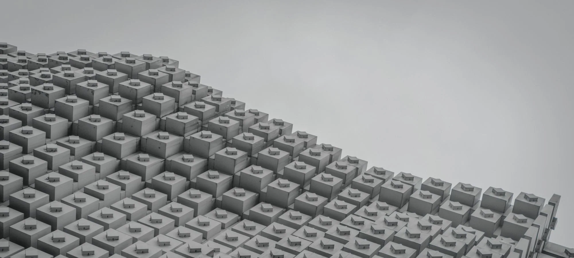 Superfície de blocos modulares em cinza, imagem das quotas como partes de um mesmo todo na sociedade limitada